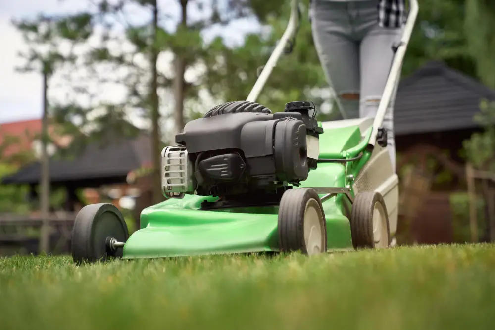 A lawn mower doing someone's gardening services near Wakefield to show Complete Value Lawn Care.