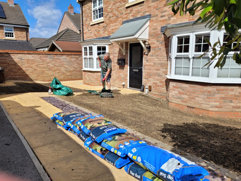a professional lawn renovation in progress in Wrenthorpe near Wakefield