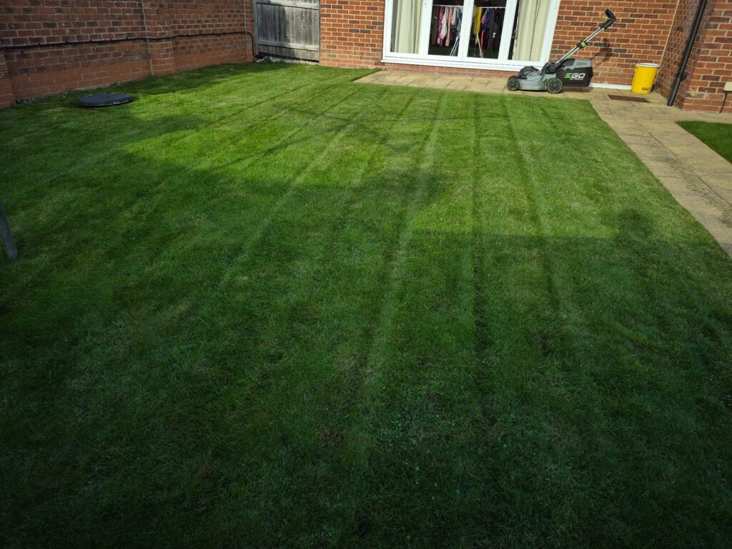 Freshly cut striped garden lawn maintained in Wakefield