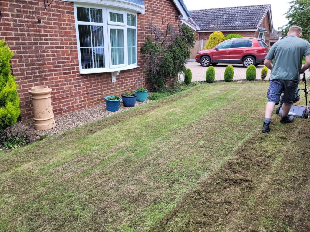 Lawn scarification in progress in Wakefield